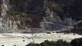 Rescuers at the site where the family died at the Solfatara Crater.