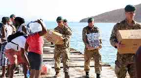 Royal Marines deliver aid and provide support to the islanders of Jost Van Dkye, British Virgin Islands.
