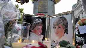 Flowers and photos of Diana on the plinth of the Flame of Liberty statue in Paris.