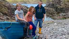 Rescued: Eve Watson and Fearn Hayley with Jamie Magee.