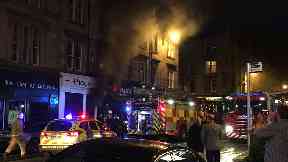 Piece: Firefighters at scene of blaze.