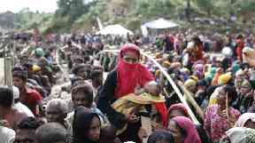 Rohingya refugees wait for aid in a camp in Bangladesh.