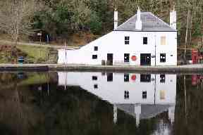 Reflections on still water on the Crinan Canal.