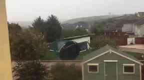 A trampoline was filmed being hurled through a garden as Storm Ophelia blasted through Ireland.