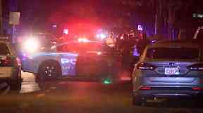 Police at the scene of one of the shootings.