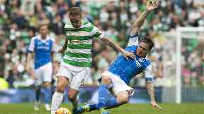 St Johnstone's Paul Paton tackles Celtic forward Leigh Griffiths.