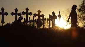 A makeshift memorial with crosses has been placed near the scene of Sunday's shooting.