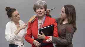 The finishing touches are put on the waxwork of Theresa May.