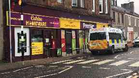 Catrine: Officers cordoned off the shop.