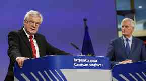 Britain's Brexit Secretary David Davis (L) and European Union (EU) chief negotiator Michel Barnier.