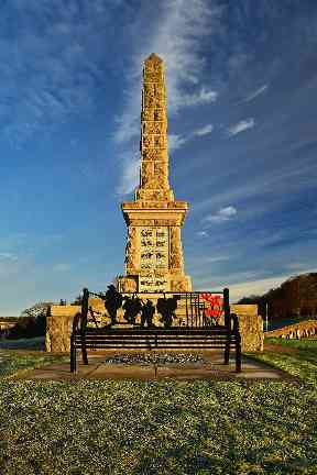 Strathaven's war memorial as the sun rises.