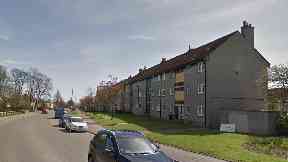 Rosehill Drive: Police remained outside flats.