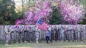 Cassie Lohrey gathered servicemen who knew her husband for the reveal.