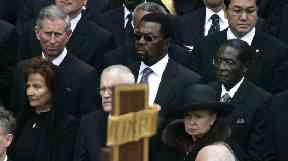 Robert Mugabe seated near Prince Charles at Pope John Paul II's funeral.