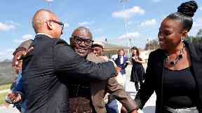 Wilbert Jones hugs friends and family as he walks free after nearly 50 years in jail.