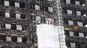 Work is underway to cover the tower with white sheets and is expected to take another 15 weeks.