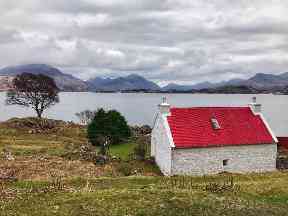 Red roofed cottage by Loch Torridon.