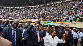 Emmerson Mnangagwa and his wife Auxillia arrive at the stadium.