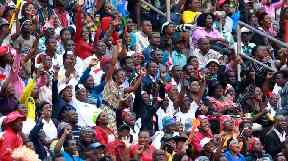 Thousands packed into Zimbabawe's national stadium in Harare to see the inauguration.