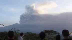 Local villagers watch on as Mount Agung erupts.