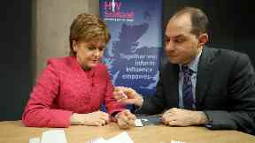 Test: Nicola Sturgeon with HIV Scotland's George Valiotis.