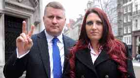 Paul Golding, leader of Britain First, and the party's deputy leader, Jayda Fransen, arrive at the Royal Courts of Justice in central London.