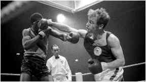 Boxer Tom Imrie on his way to winning gold for Scotland in 1970.
