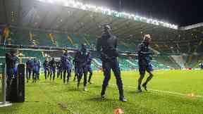 Anderlecht players train under the Celtic Park lights.