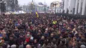Supporters of Mr Saakashvili at his rally after he escaped arrest.