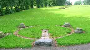 The stone is surrounded by the four Paisley Tolbooth stones.