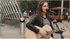 Star in the making: Natasha was busking in Glasgow when she was spotted.