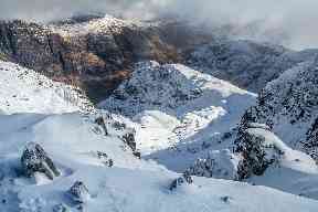 Looking down on the snowy Three Sisters at Glen Coe.