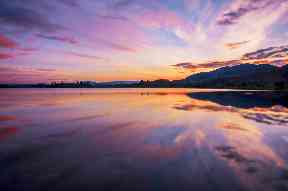 Watercolour skies overlook the Lake of Menteith at the Carse of Stirling.