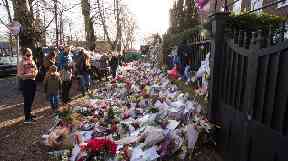 Fans laid flowers and tributes outside Michael's north London home after his death.