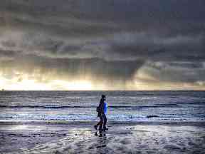Walking under moody skies.