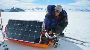 Barney Swan using a solar panels