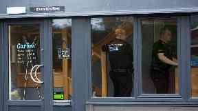 Officers were seen inside the restaurant on Tuesday.
