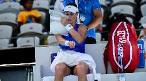 Ekaterina Makarova uses an ice bag to cool down at the Sydney International.