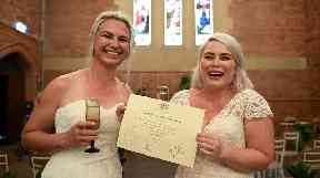 Sarah Turnbull (left) and Rebecca Hickson pose for a photograph with their Certificate of Marriage after being married in a ceremony in Newcastle, Tuesday, January 9, 2018.