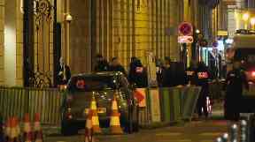 French police attend the scene outside the Ritz Hotel in Paris, France.