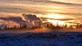 Striking shot: Misty sunset over Eaglesham Moor.