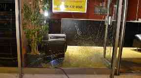 The smashed window of Spicy Night.