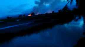 Gu Dar Pyin burns in distance.