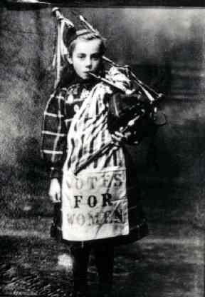 Bessie Watson, aged 9, dressed for the Womens Franchise Procession and Demonstration in October 1909. Reproduced with the permission of The People's Story, Edinburgh Museums & Galleries.