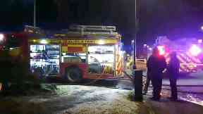 Fire: Smoke billowed from garage.