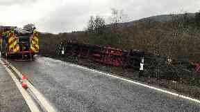Lorry crash: HGV overturned at side of road.