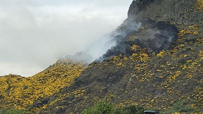 Arthur's Seat: Smoke can be seen rising from the hill.