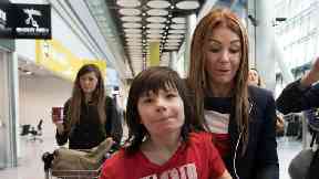 Charlotte Caldwell and her son Billy at Heathrow Airport.