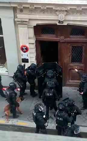 Police in riot gear at the scene of the hold up.