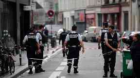 Police cordon off the area near the scene of a hostage situation.